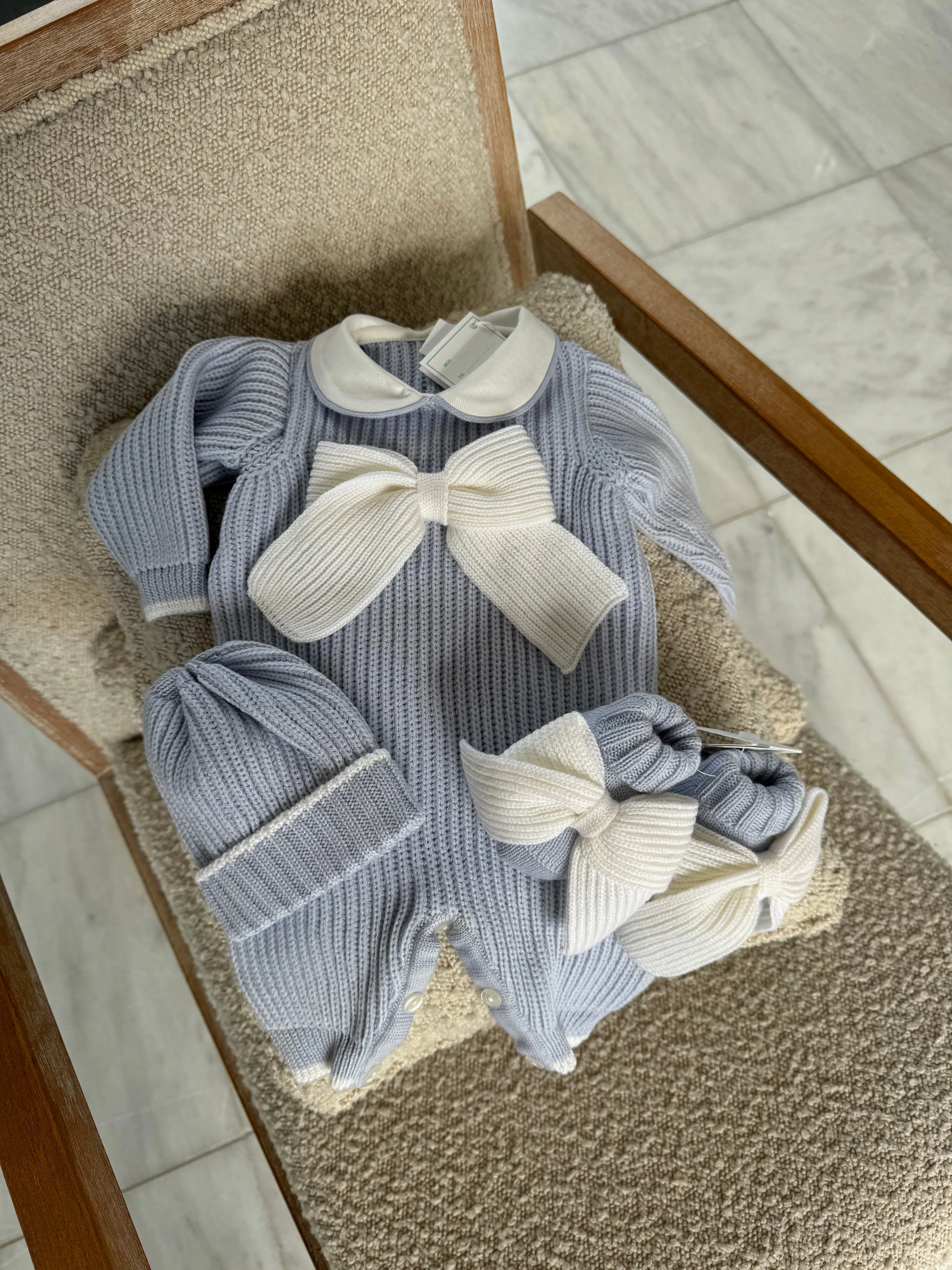 Beautiful knitted Merino Wool Blue Baby Booties with Bow details.