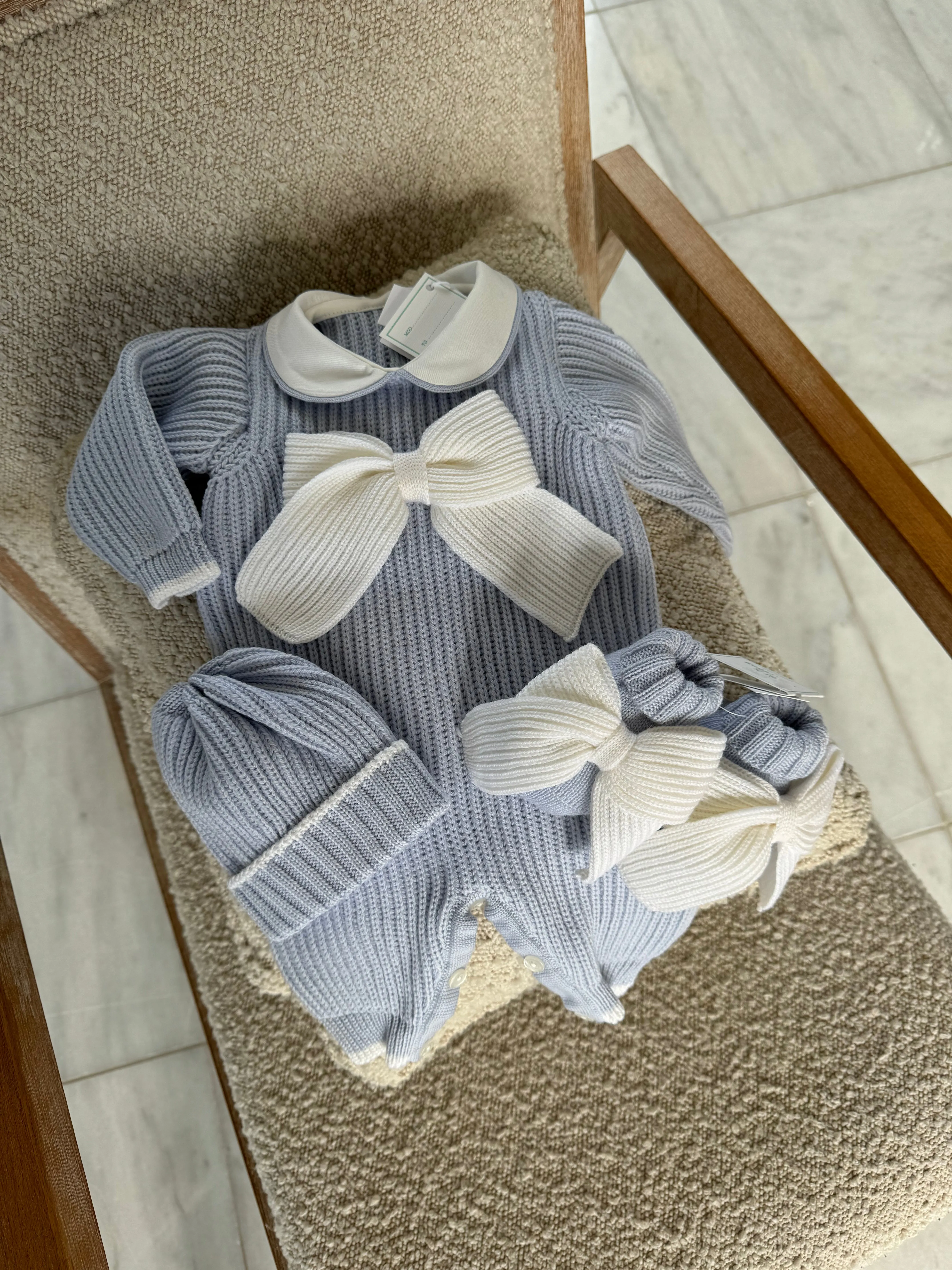 Beautiful knitted Merino Wool Blue Baby Booties with Bow details.