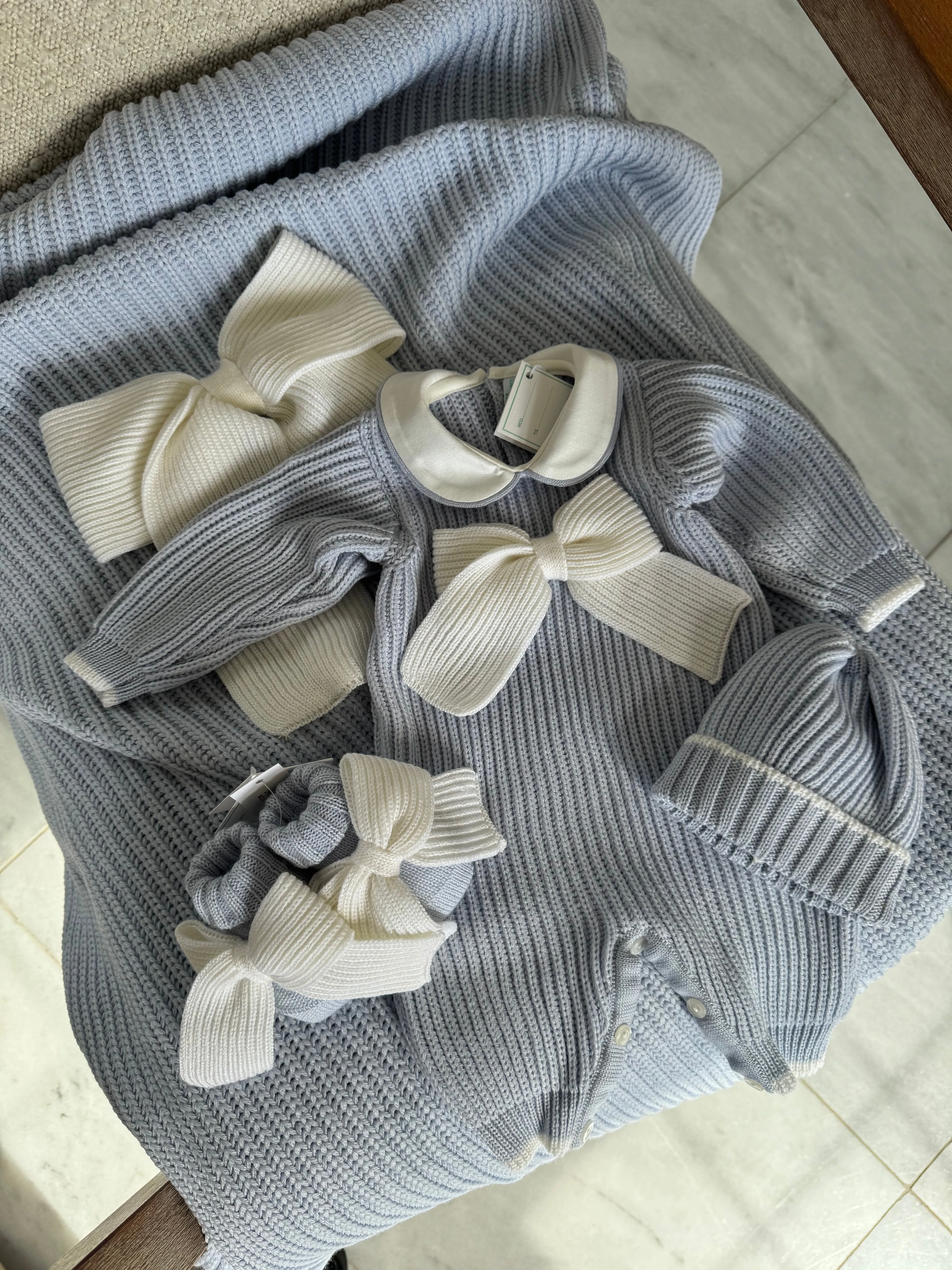 Beautiful knitted Merino Wool Blue Baby Booties with Bow details.