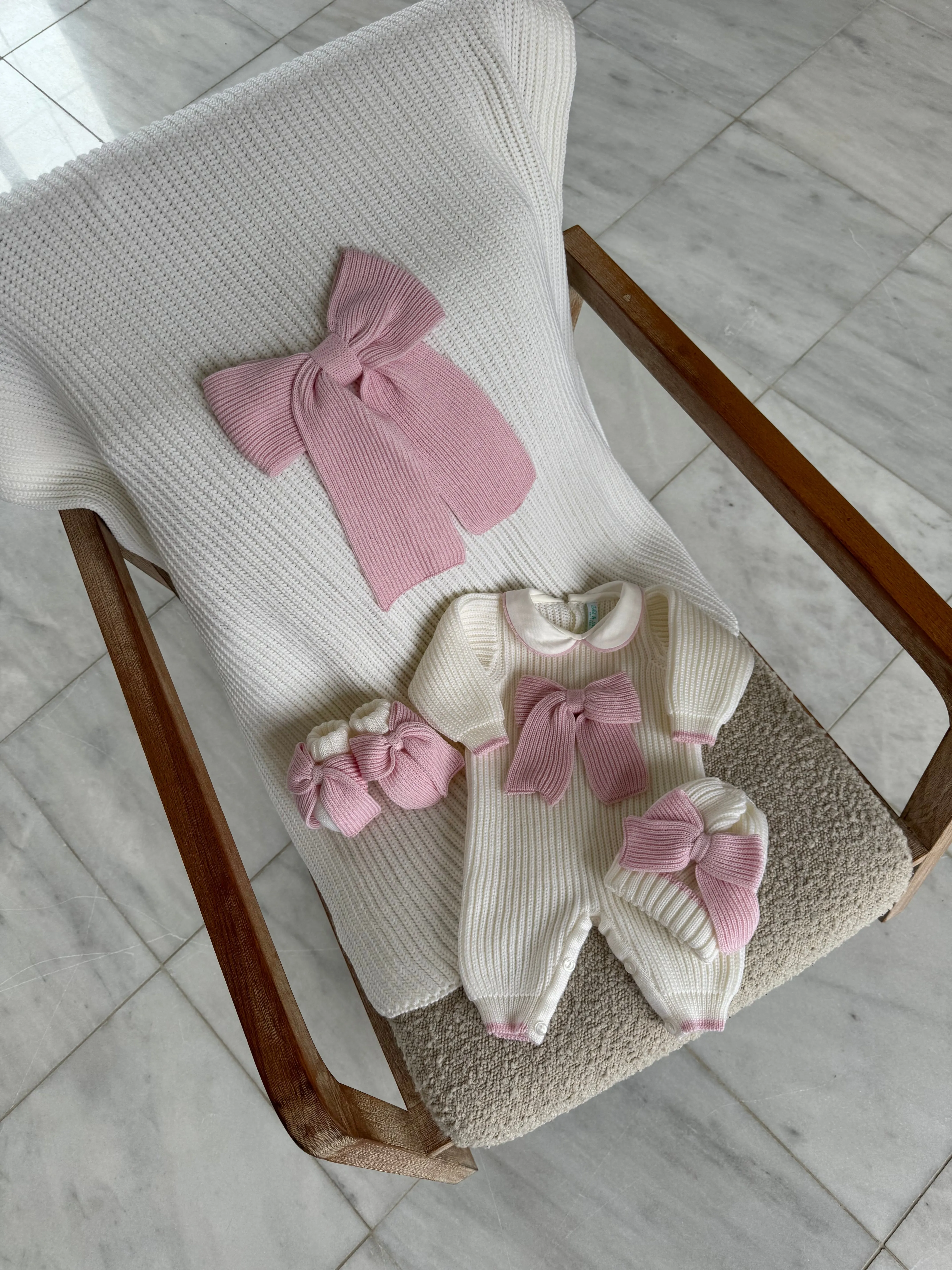 Beautiful knitted Merino Wool Ivory/White Baby Booties with Bow details.