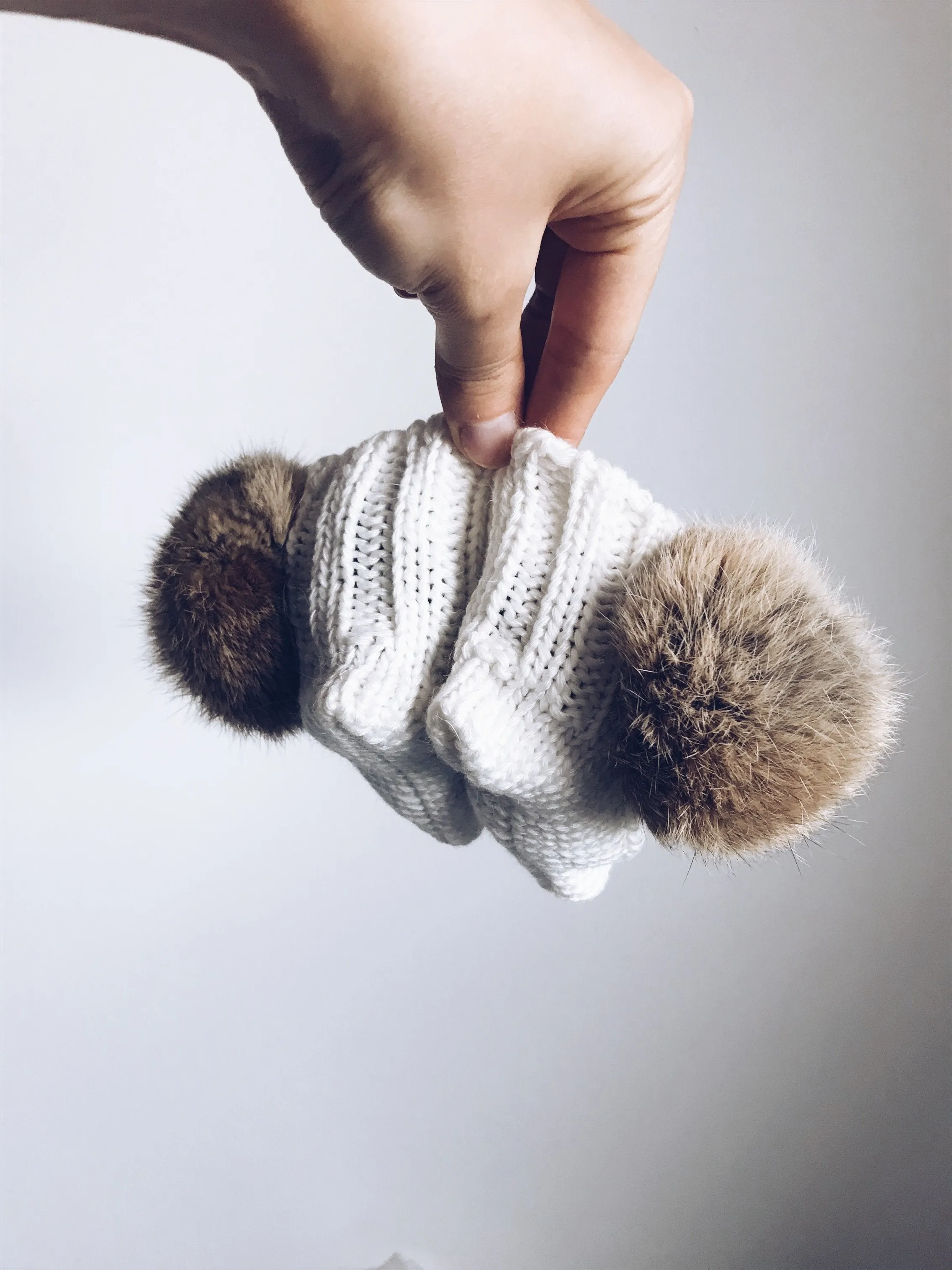 MILOVES Signature Hand Knitted baby booties with rabbit fur pompoms
