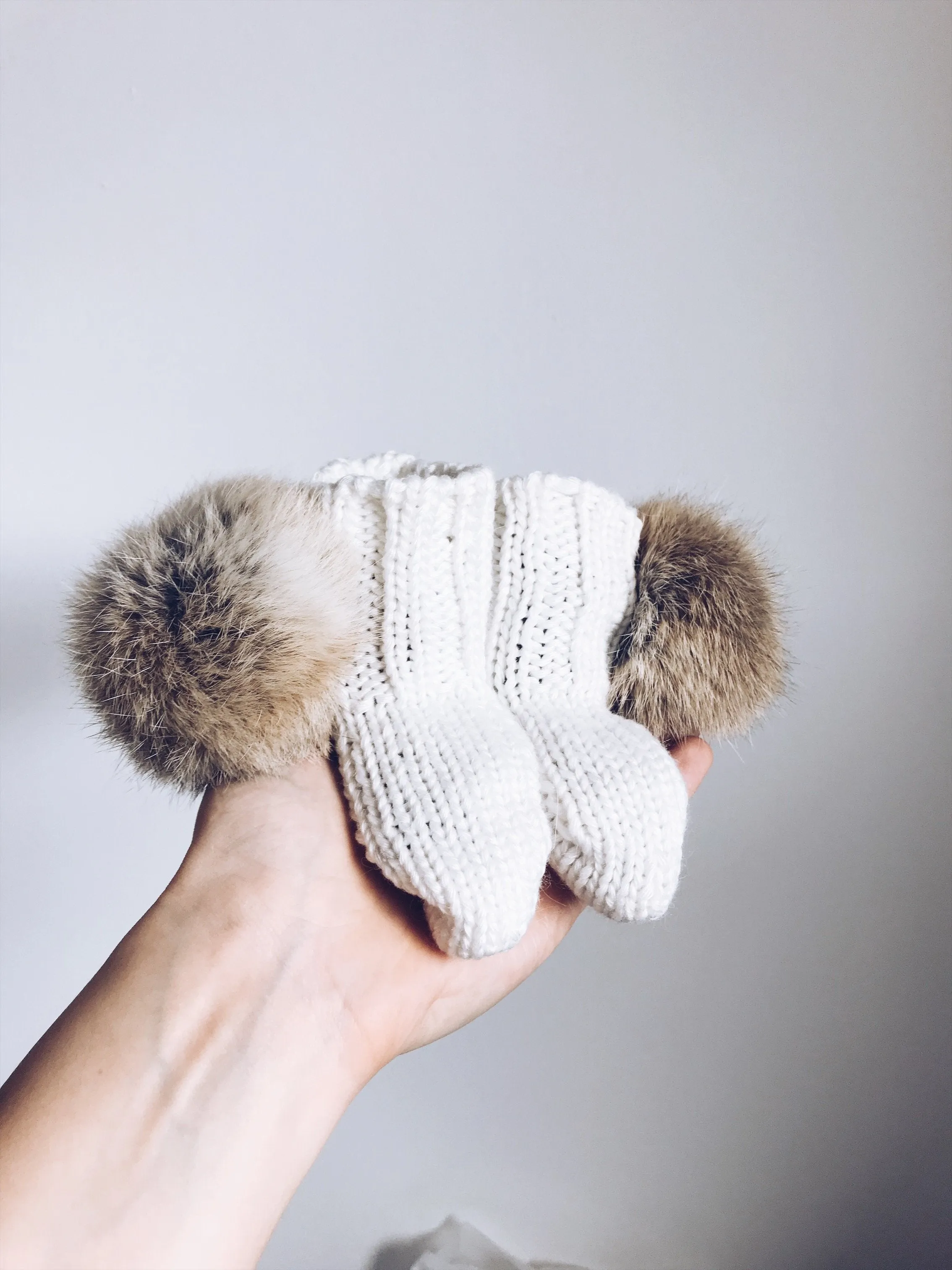 MILOVES Signature Hand Knitted baby booties with rabbit fur pompoms