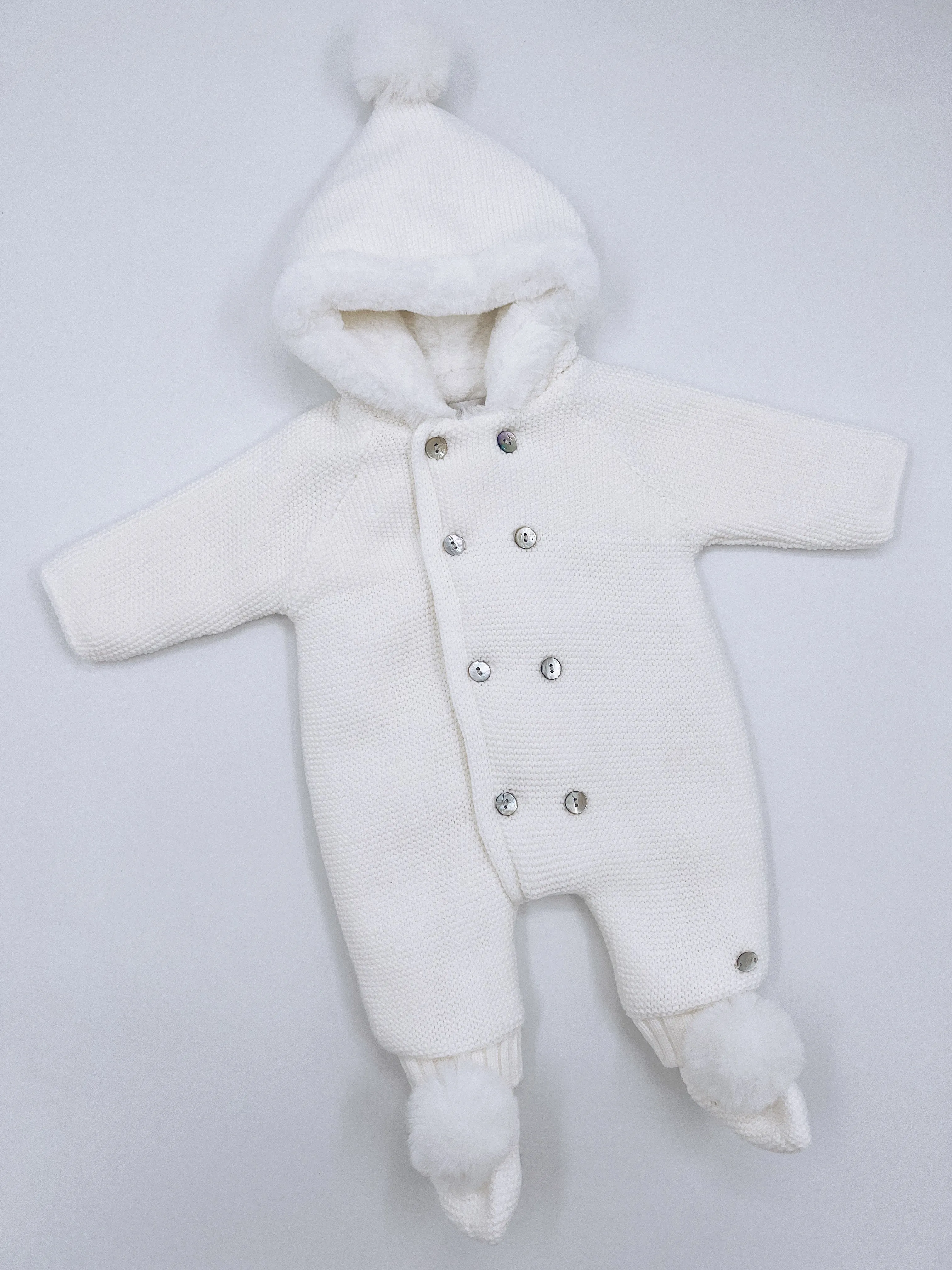White knitted Baby pramsuit with matching knitted pompom booties.